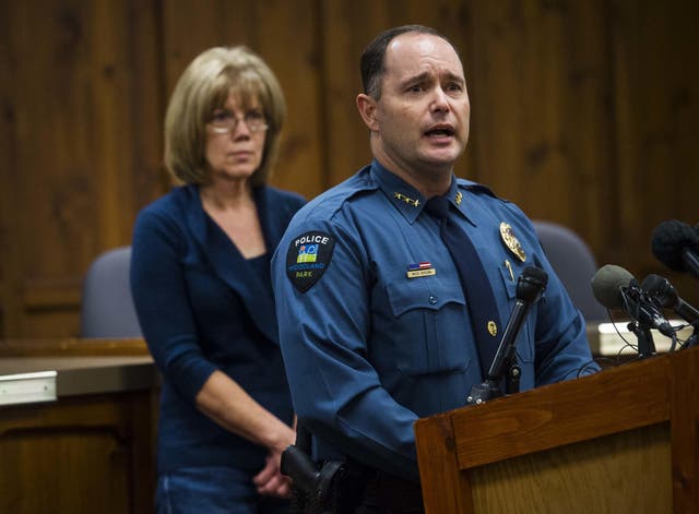 Woodland Park Police Chief Miles De Young answers questions about the disappearance of resident Kelsey Berreth, 29, while her mother, Cheryl Berreth, stands in the background during a news conference at City Hall in Woodland Park, Colorado