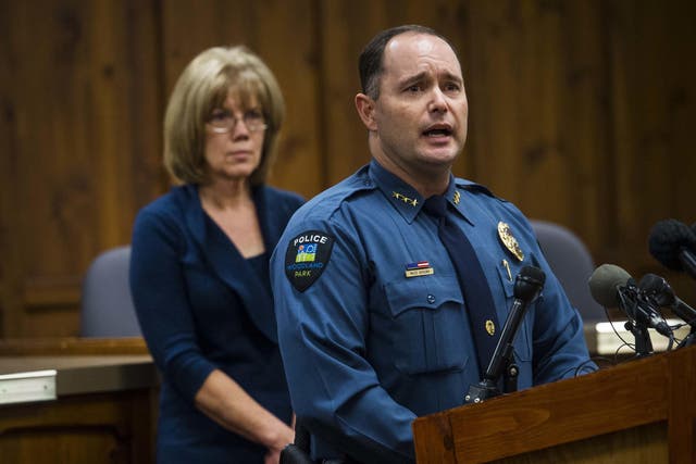 Woodland Park Police Chief Miles De Young answers questions about the disappearance of resident Kelsey Berreth, 29, while her mother, Cheryl Berreth, stands in the background during a news conference at City Hall in Woodland Park, Colorado