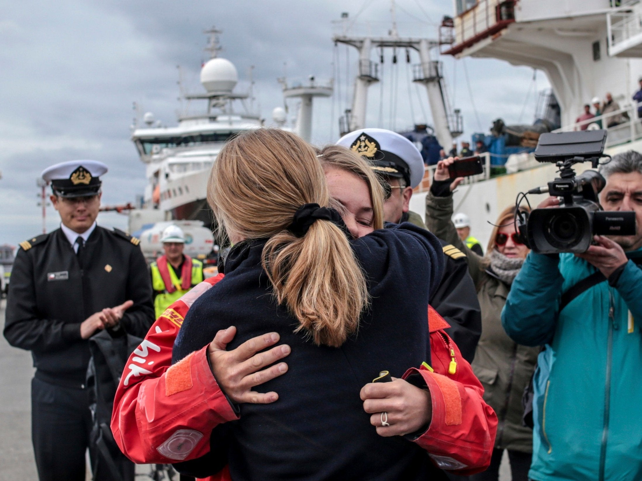 British solo sailor Susie Goodall embraces her mother after arriving on the cargo ship MV Tian Fu in Punta Arenas, Chile, on Friday