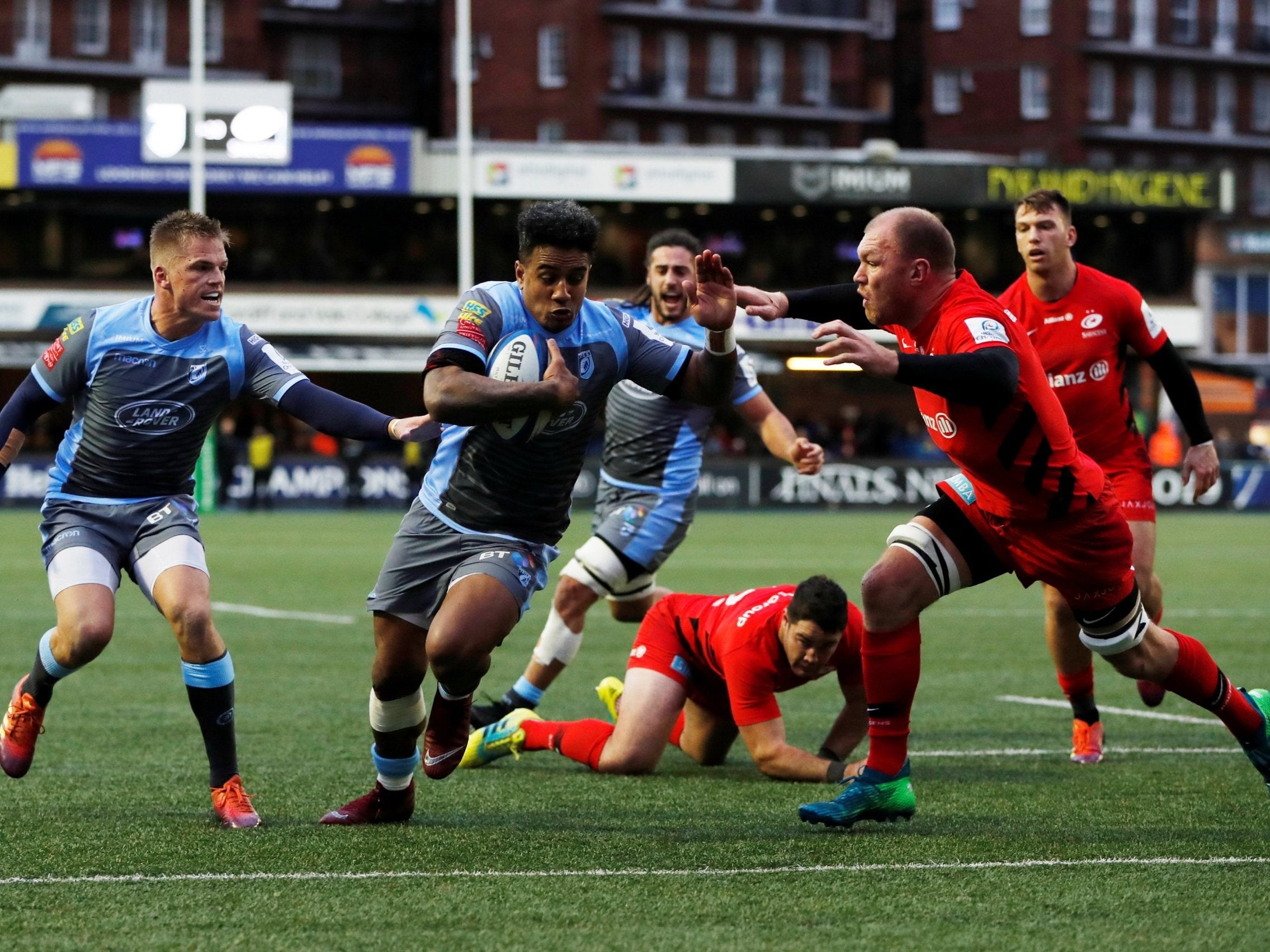 Ray Lee-Lo tries to evade the tackle of Saracens' Schalk Burger