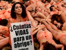 Animal rights activists strip naked in anti-fur protest in Barcelona