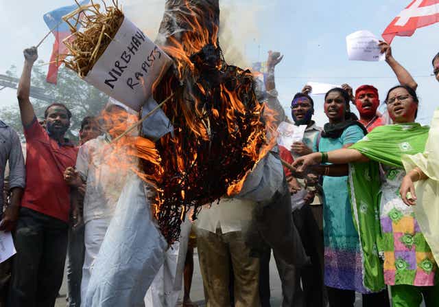 Activists burn an effigy representing the rapists involved in the 2012 attack on Delhi student 'Nirbhaya'