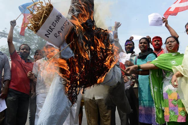 Activists burn an effigy representing the rapists involved in the 2012 attack on Delhi student 'Nirbhaya'