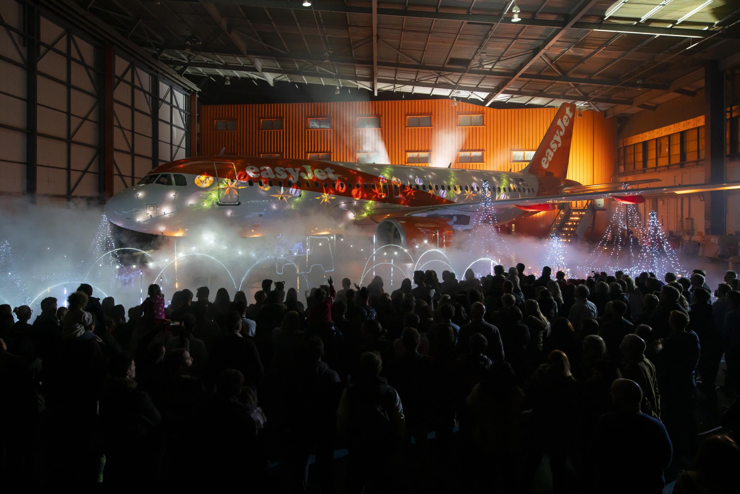 Crowds gather in front of the glowing jet