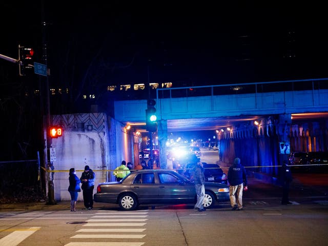 Police investigate the scene where two officers were killed by a train in Chicago