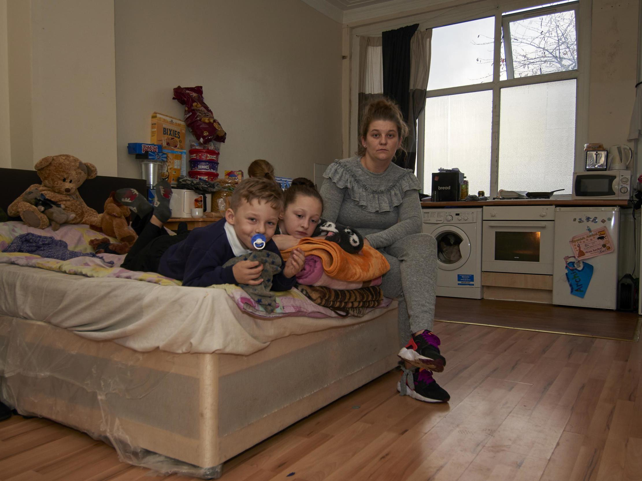 Carly Stutter and her three children share a two-bed room