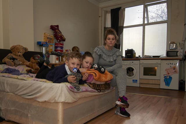 Carly Stutter and her three children share a two-bed room