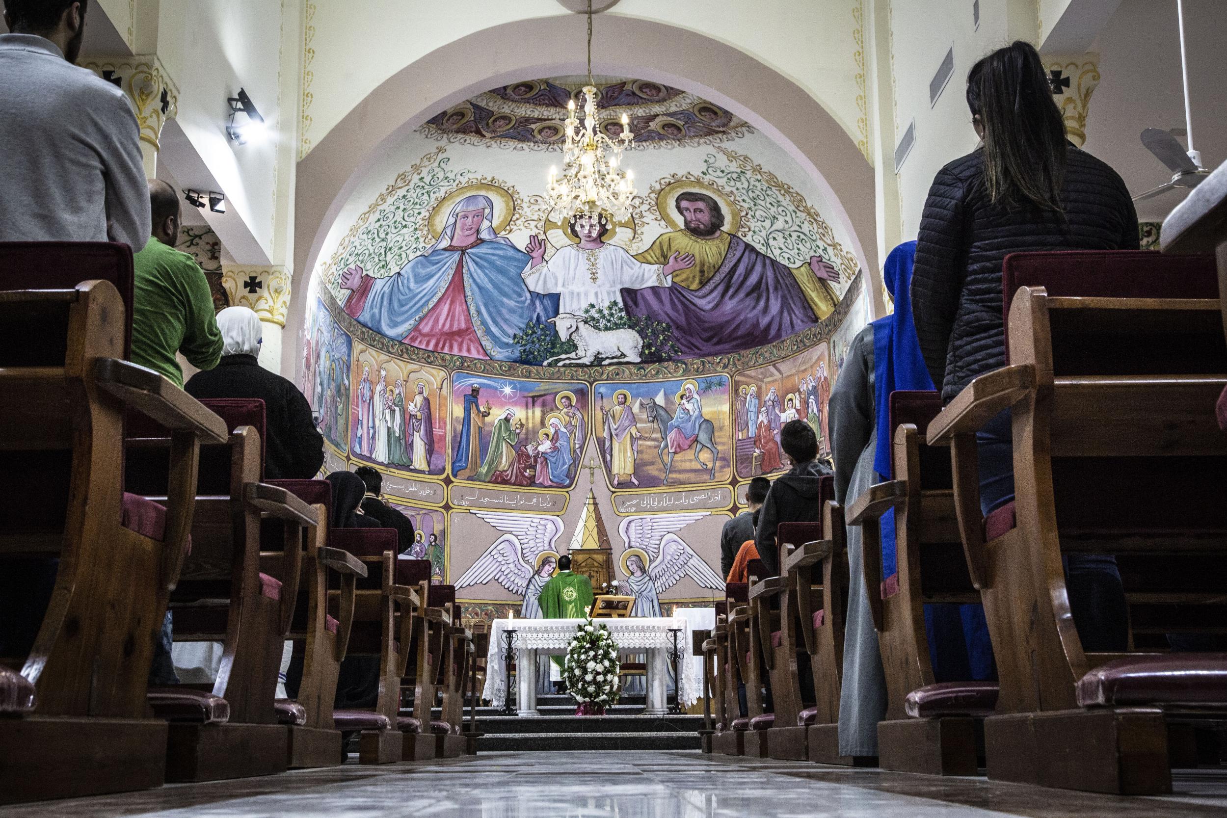 Worshippers gather at the Holy Family Church in Gaza