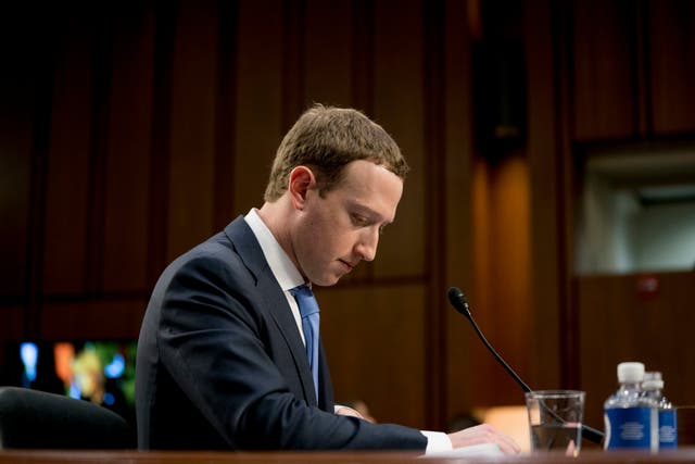 Facebook CEO Mark Zuckerberg pauses while testifying before a joint hearing of the Commerce and Judiciary Committees on Capitol Hill in Washington