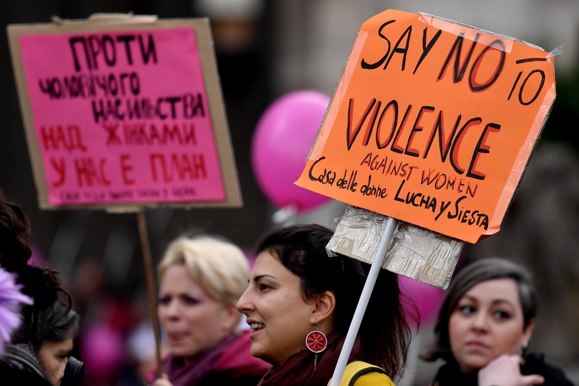 Demonstrators mark the International Day for the Elimination of Violence Against Women in Rome (AFP/Getty)