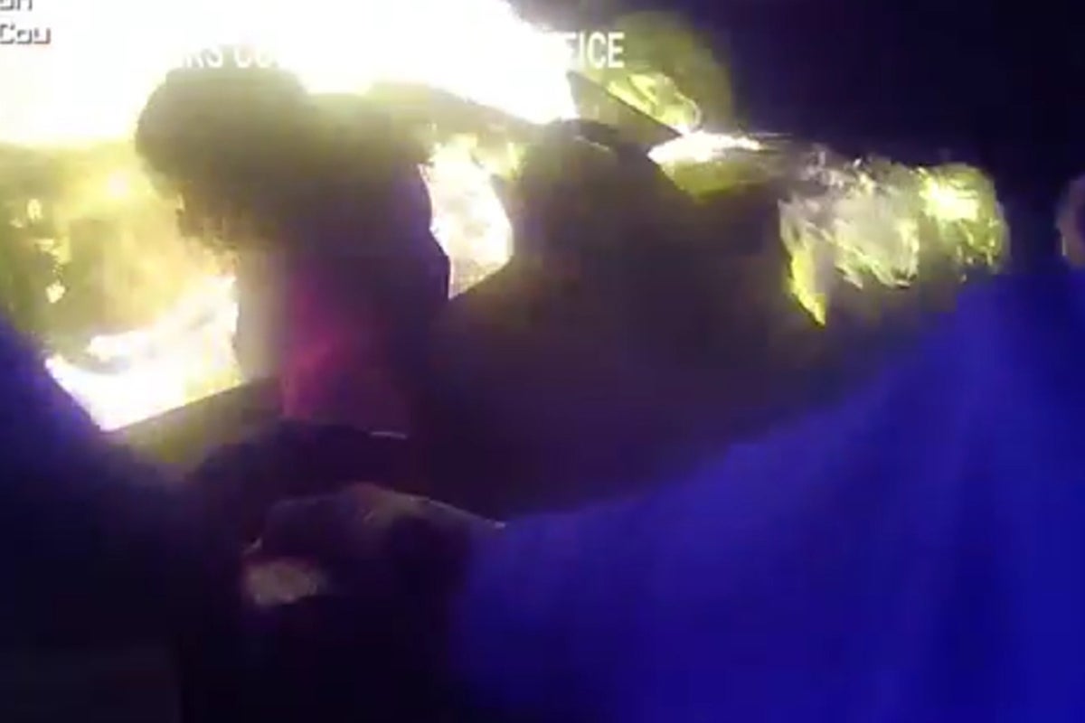 Police bodycam video shows man being rescued from burning car in Texas ...