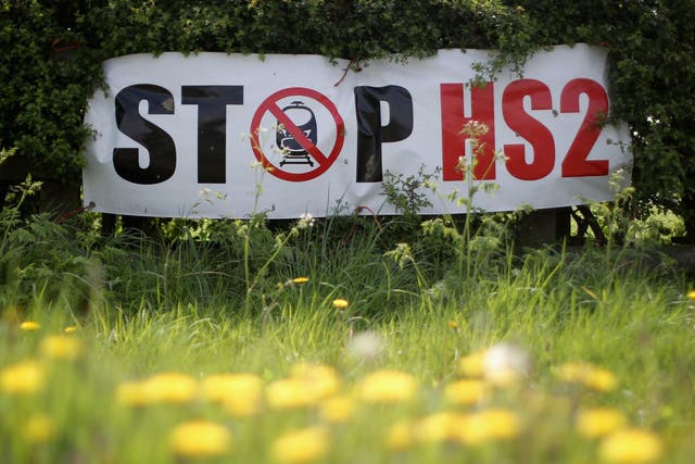 Protesters' posters mark the point where the proposed route of HS2 line will pass through near to the village of Warburton in Cheshire