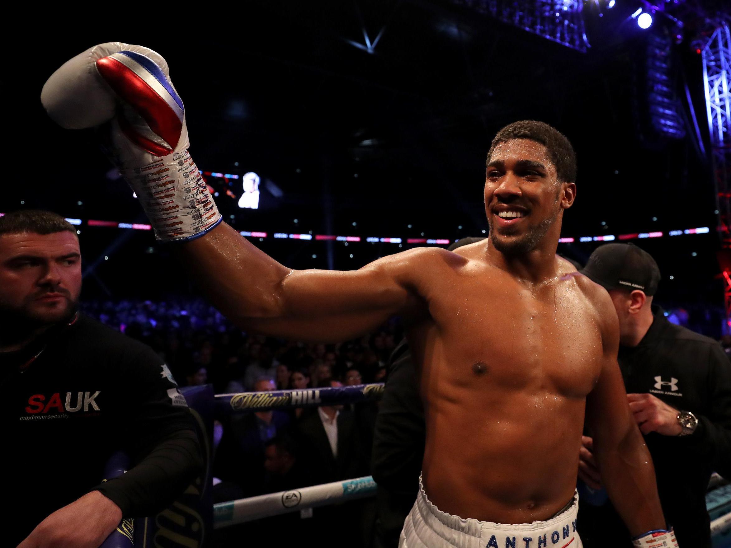 Anthony Joshua salutes the fans