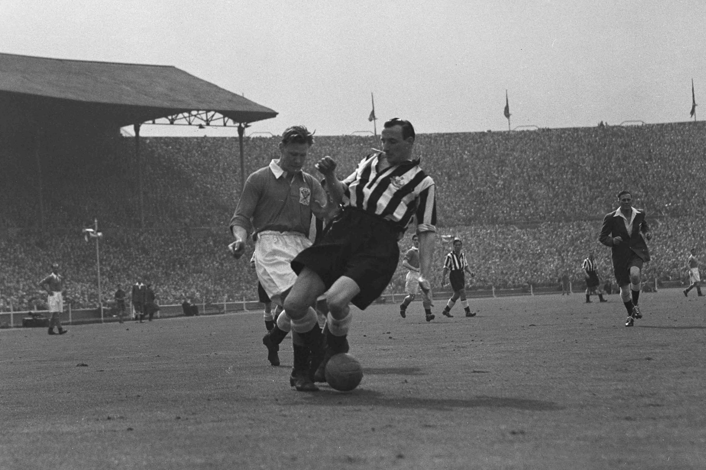 Slater (left) for Blackpool against Newcastle United in 1951; he was the last amateur player to appear in an FA Cup final