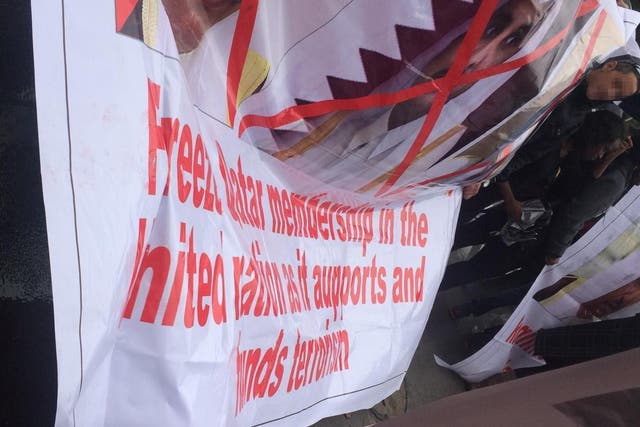 Anti-Qatar banners paraded at fake demonstration outside UN in New York