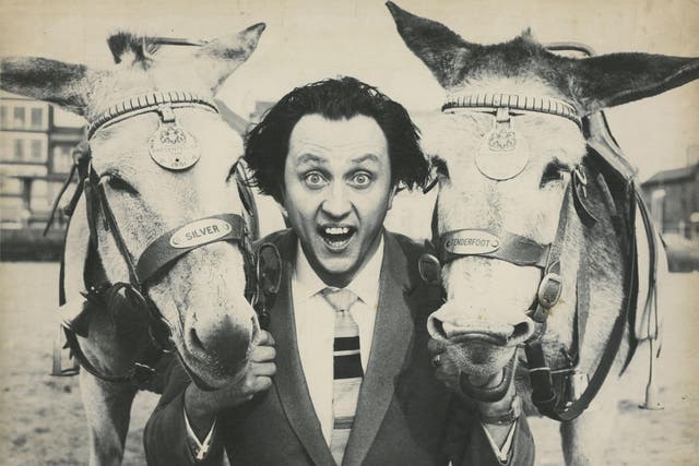 Buck-toothed, crazy-haired comedian Ken Dodd