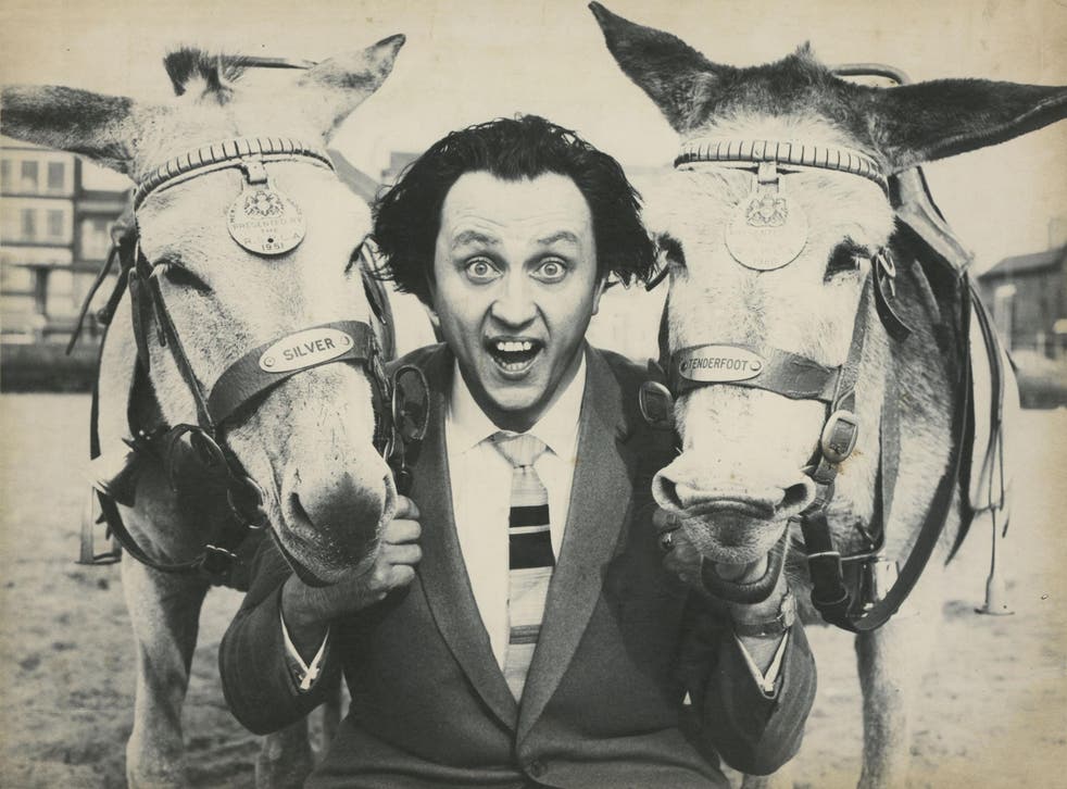 Buck-toothed, crazy-haired comedian Ken Dodd