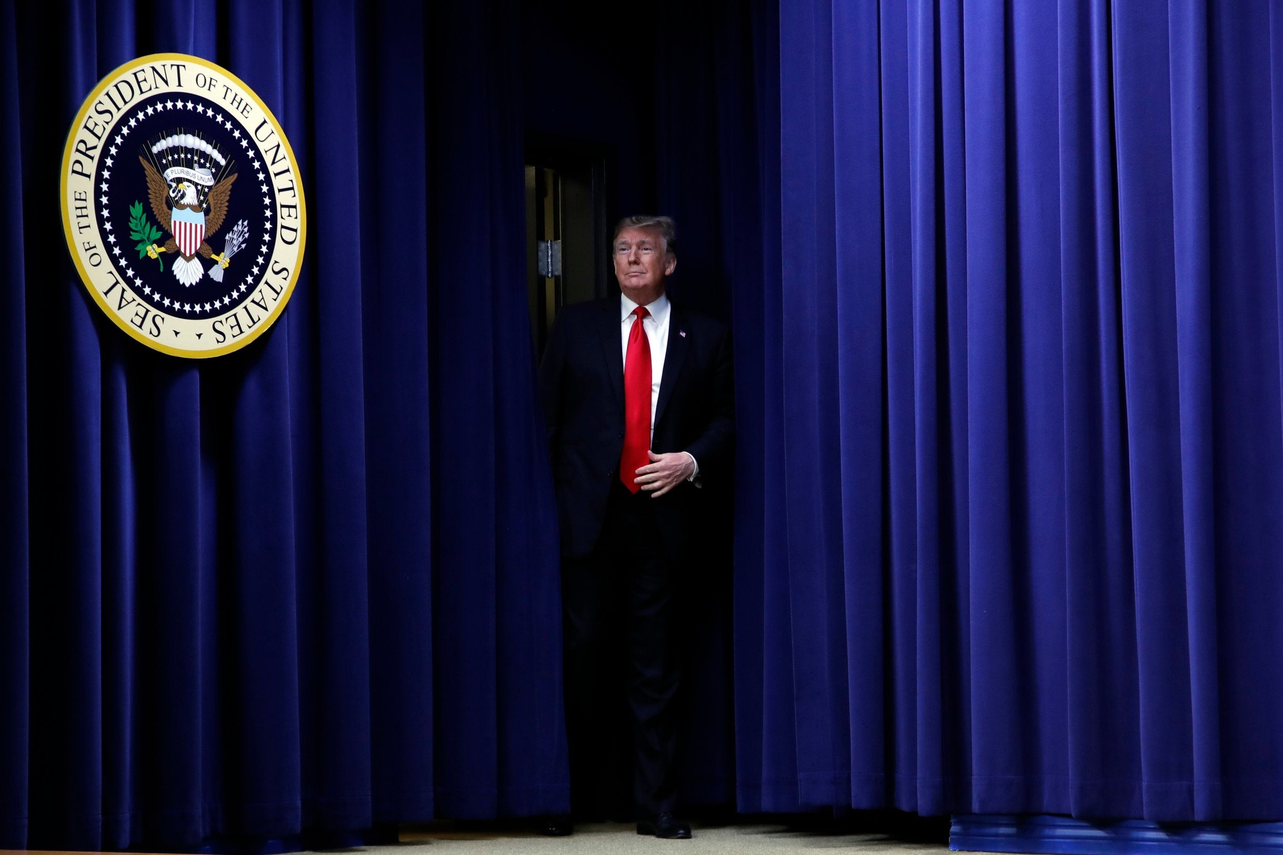 President Donald Trump arrives to speak during a signing ceremony for HR 2, the "Agriculture Improvement Act of 2018," in the South Court Auditorium of the Eisenhower Executive Office Building