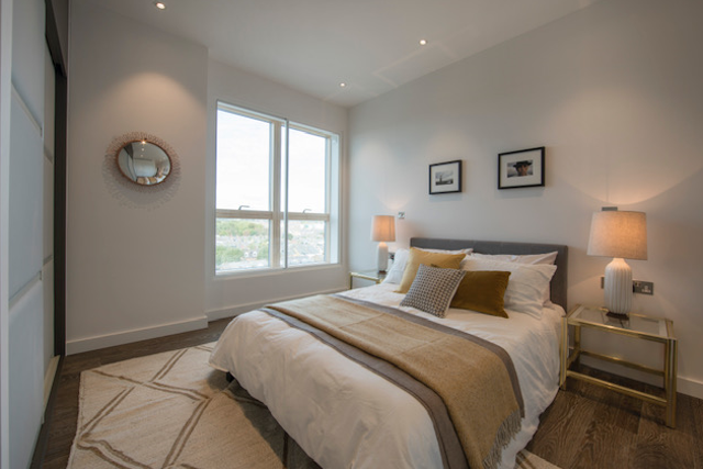 A Queens Park apartment bedroom: the appeal of the residential market within London and the UK has remained steady