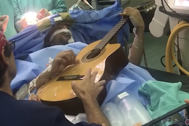 Jazz musician plays guitar during brain surgery