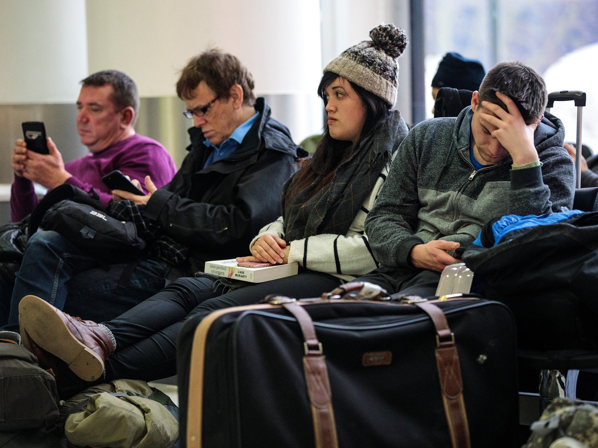 Passengers wait in the South Terminal building at London Gatwick Airport after flights resumed.