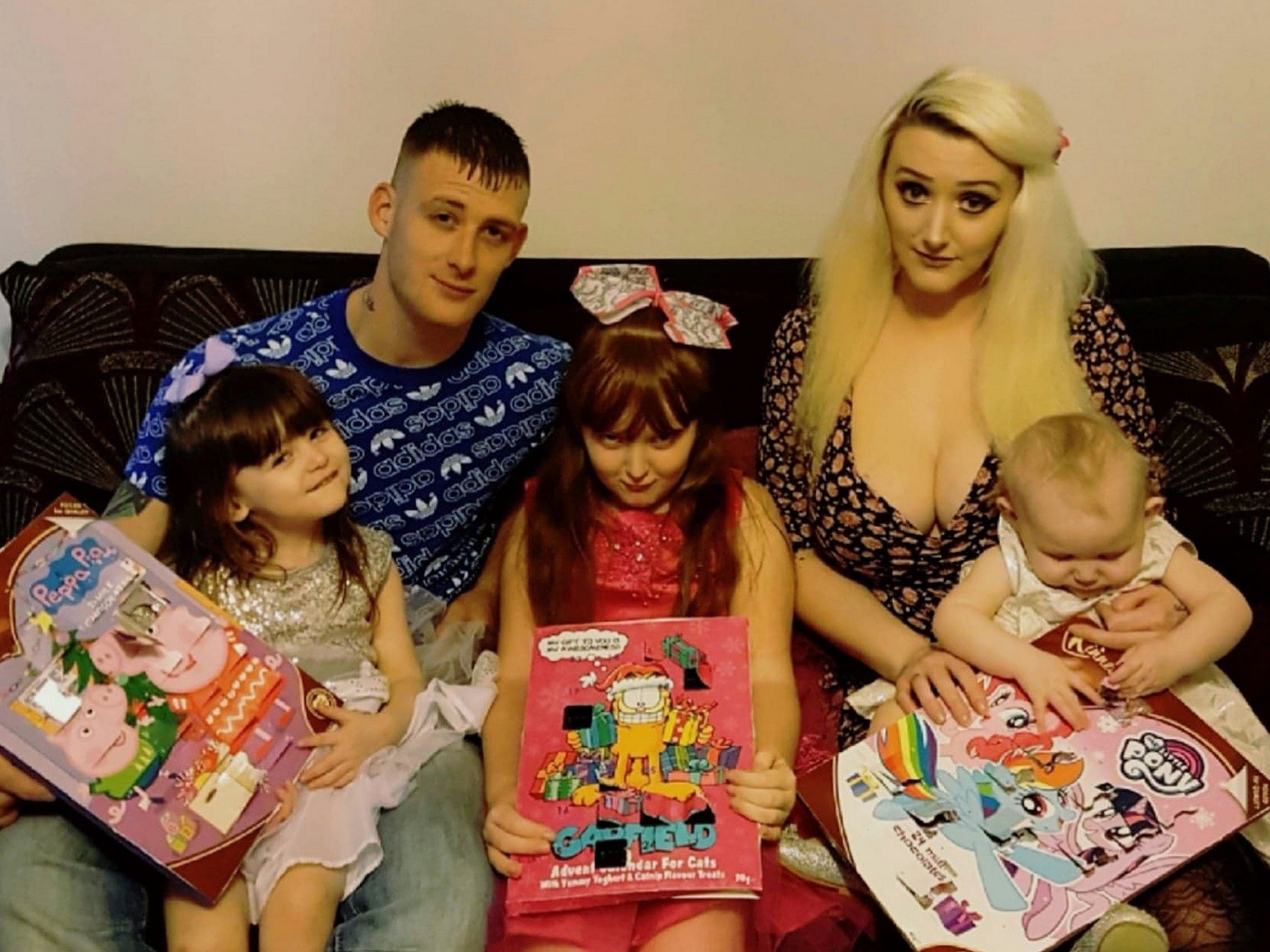 Jess Evans, 26, was shocked to discover a £1.99 Garfield advent calendar she bought from B&amp;M in Oswestry, Shropshire, for her nine-year-old daughter Alissa was in fact for cats and contained yoghurt and catnip treats. Pictured L-R: Alexis Davies-Evans, Sean Davies, Alissa Evans, Jess Evans, Aurora Davies-Evans