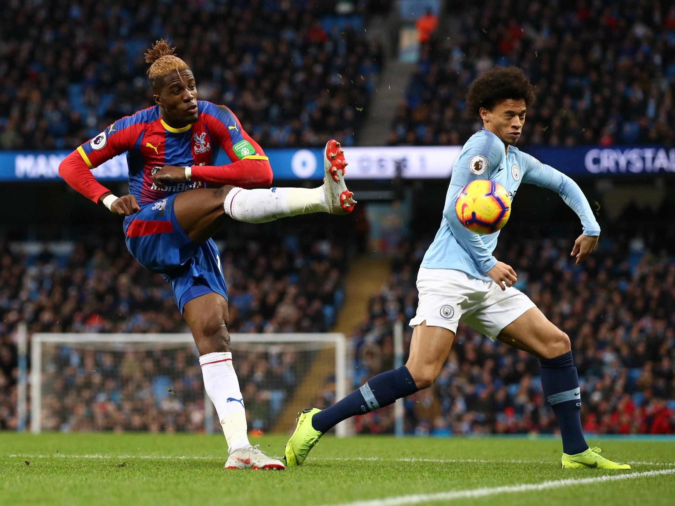 Wilfried Zaha in action against City