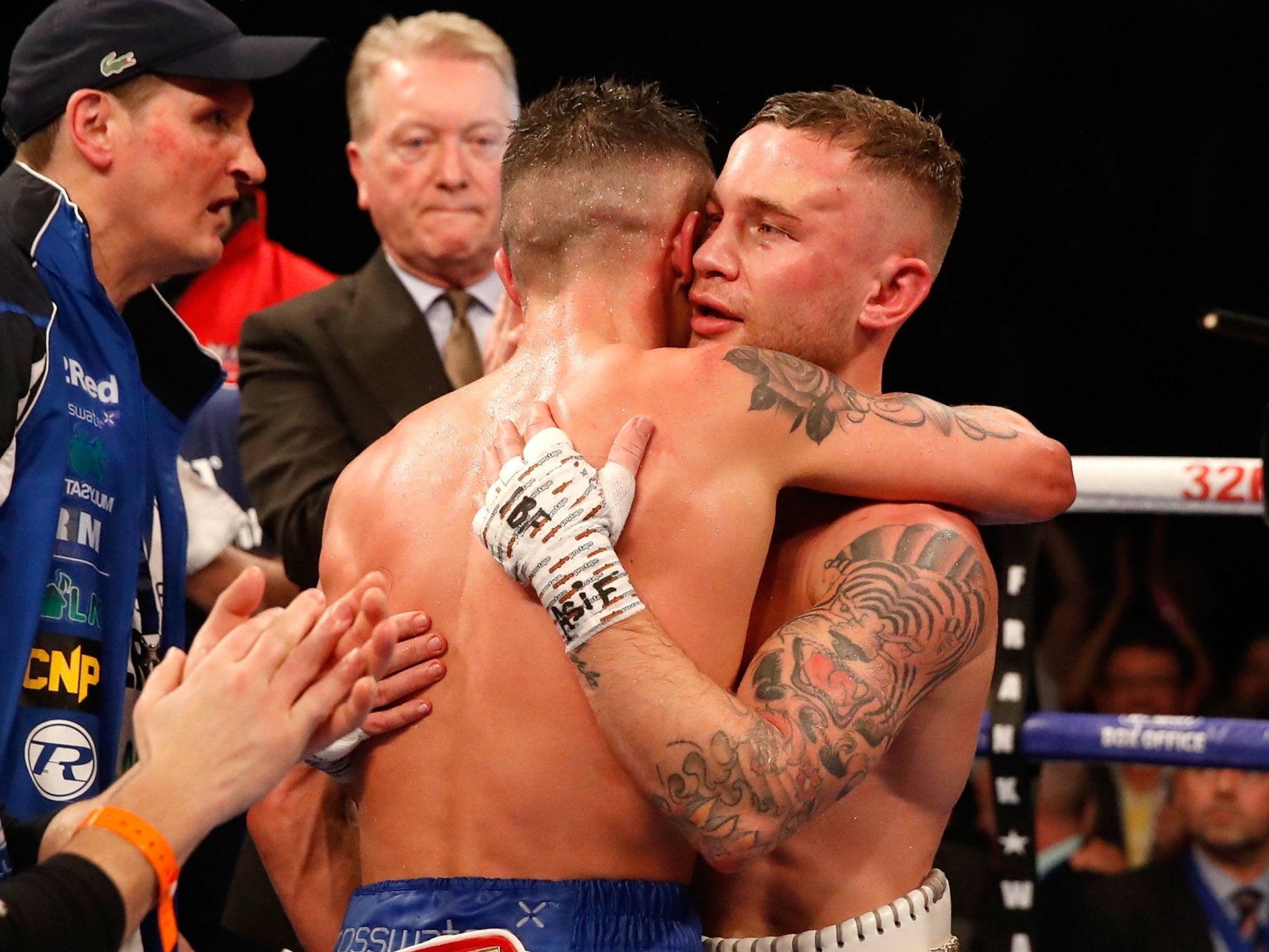 Josh Warrington and Carl Frampton embrace at the end of their featherweight epic