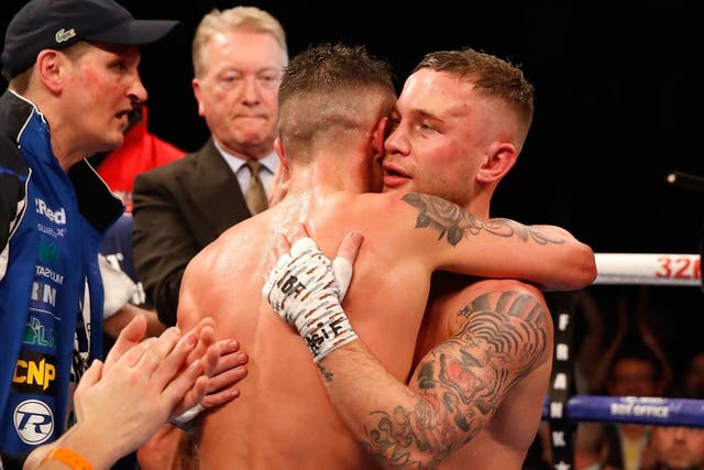 Josh Warrington and Carl Frampton embrace at the end of their featherweight epic