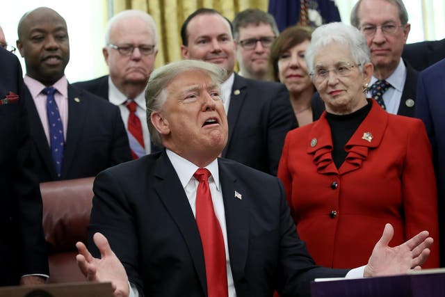 US President Donald Trump speaks on the possibility of a government shutdown during the signing ceremony for the First Step Act and the Juvenile Justice Reform Act in the Oval Office of the White House, 21 December 2018, Washington, DC.