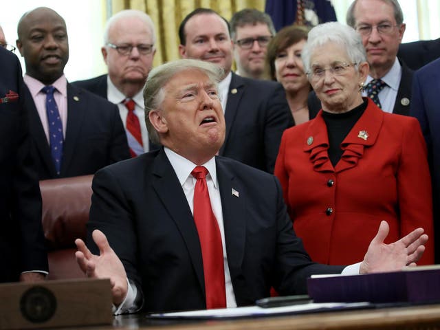 US President Donald Trump speaks on the possibility of a government shutdown during the signing ceremony for the First Step Act and the Juvenile Justice Reform Act in the Oval Office of the White House, 21 December 2018, Washington, DC.