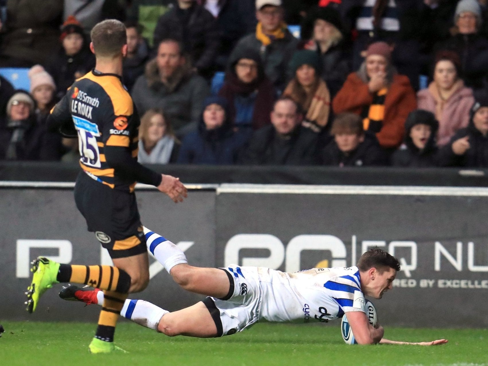 Freddie Burns slides in the score the opening try