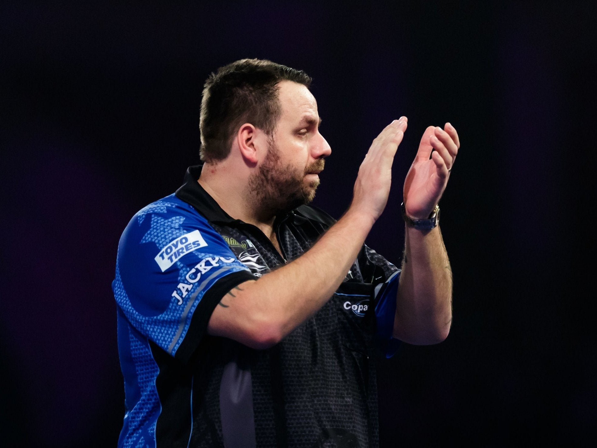 Adrian Lewis celebrates defeating Darius Labanauskas during day eleven of the World Darts Championships