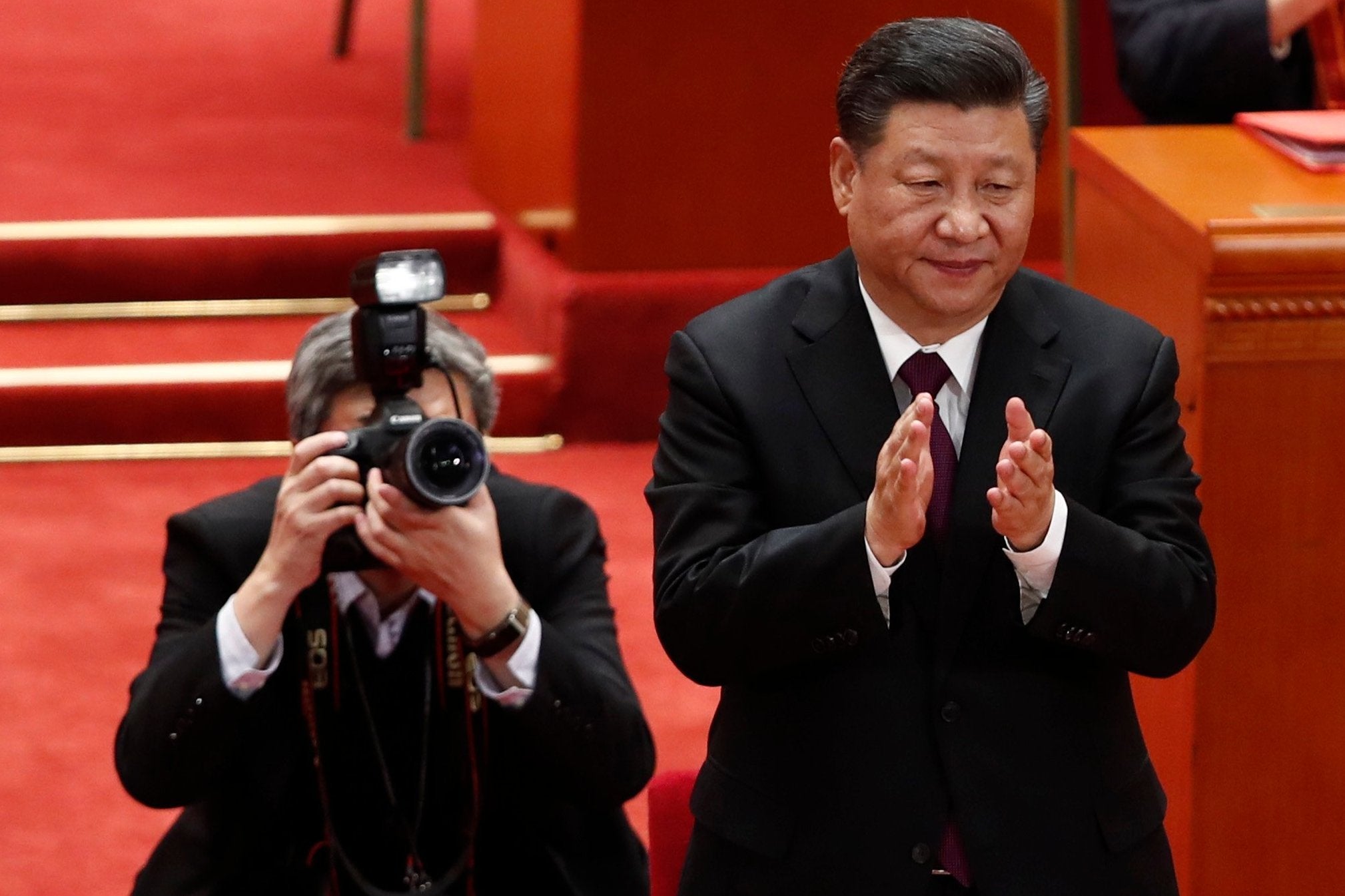 Chinese president Xi Jinping claps during a meeting held to celebrate the 40th anniversary of China’s reform (EPA/)