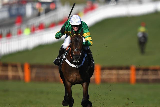 Buveur D'Air ridden by B J Geraghty on the way to victory during the Champion Hurdle Challenge Trophy at the Cheltenham Festival