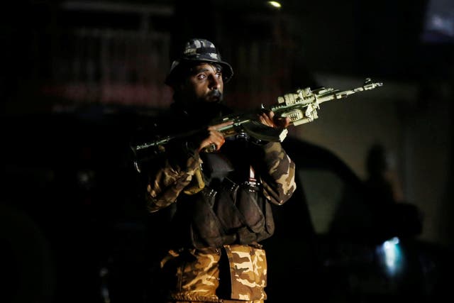 A member of Afghan security force takes position at the site of an attack in Kabul, Afghanistan December 24, 2018.