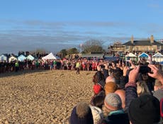 Hundreds take plunge for annual Christmas Day swim