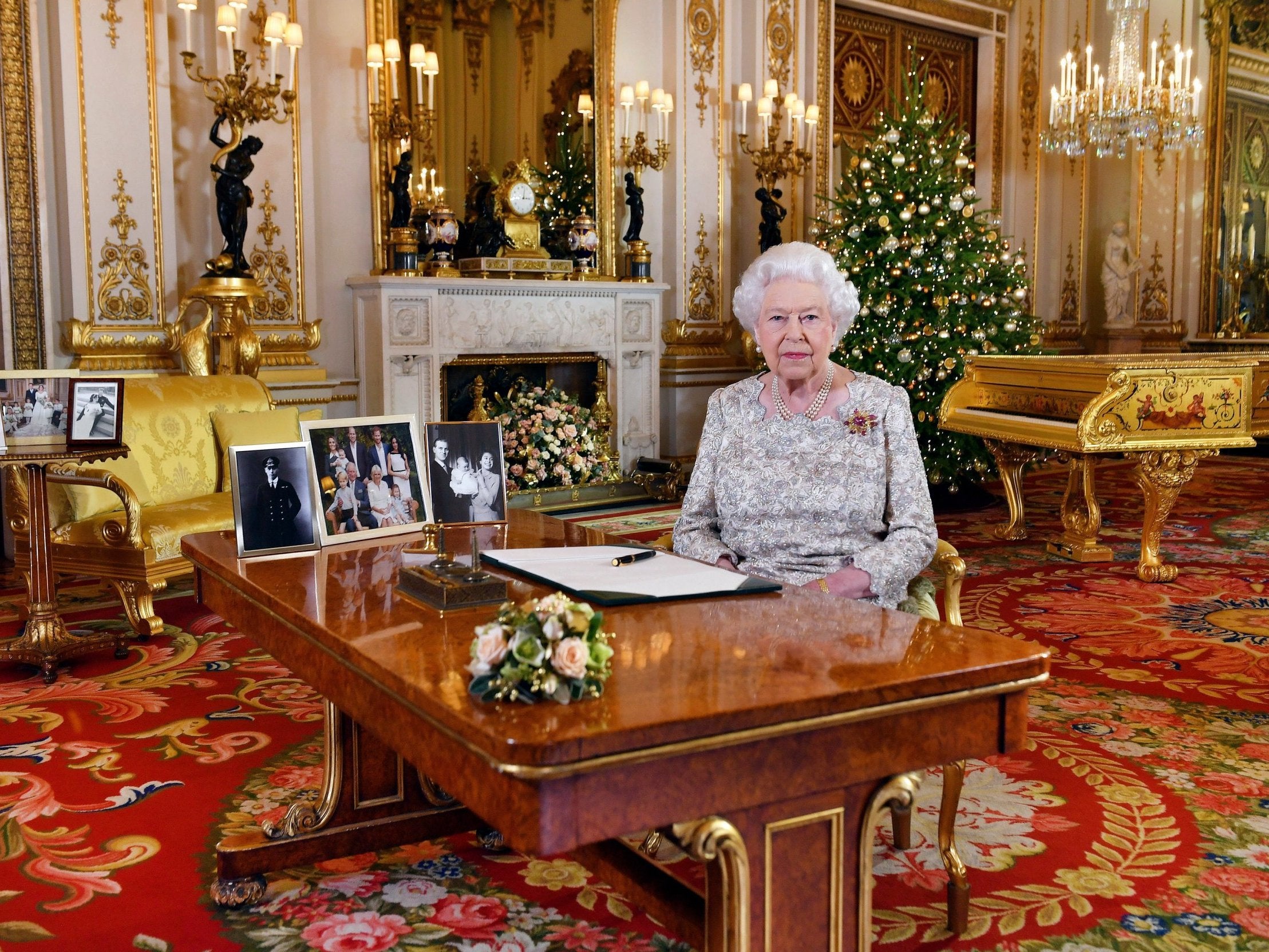 Queen Elizabeth giving her annual Christmas day message in 2018 with pictures of her family