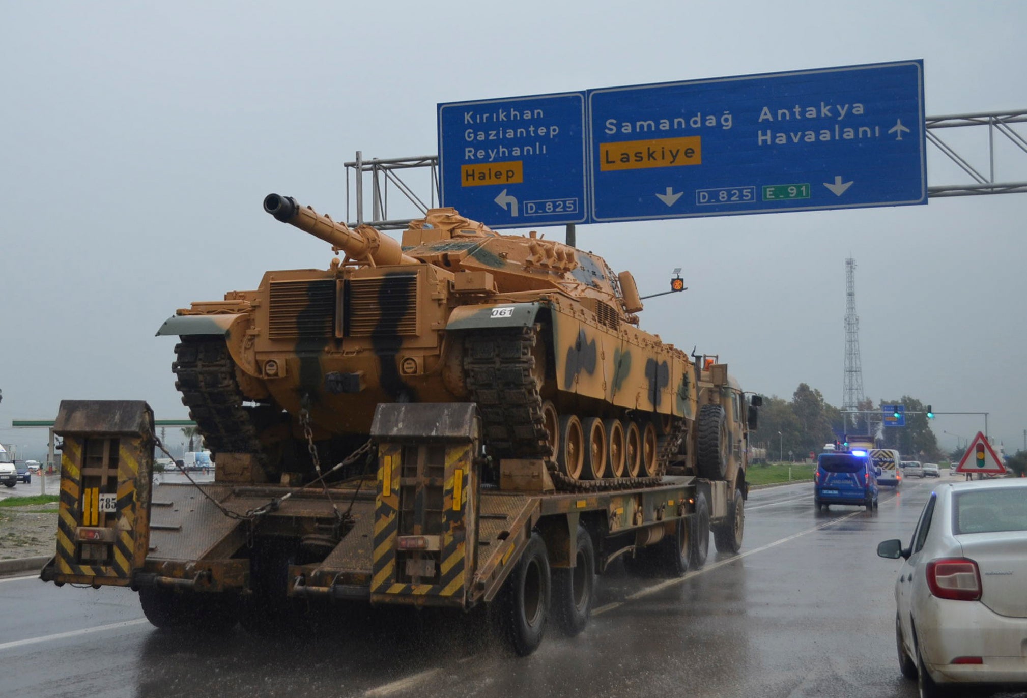 A Turkish tank is transported near the the border with Syria this month