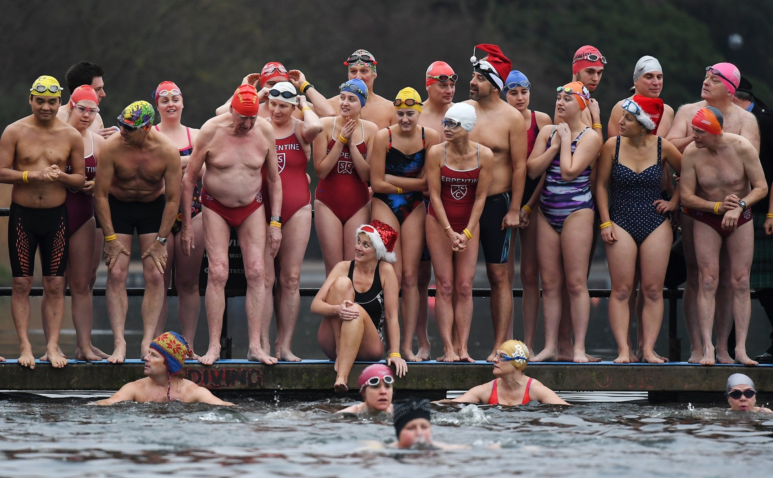Participants line up for the annual Hyde Park Christmas Day Swim at Hyde Park in London. Traditionally known as the Peter Pan Cup, members of the Hyde Park swimming club take part each year in the frosty waters of the Serpentine Lake.