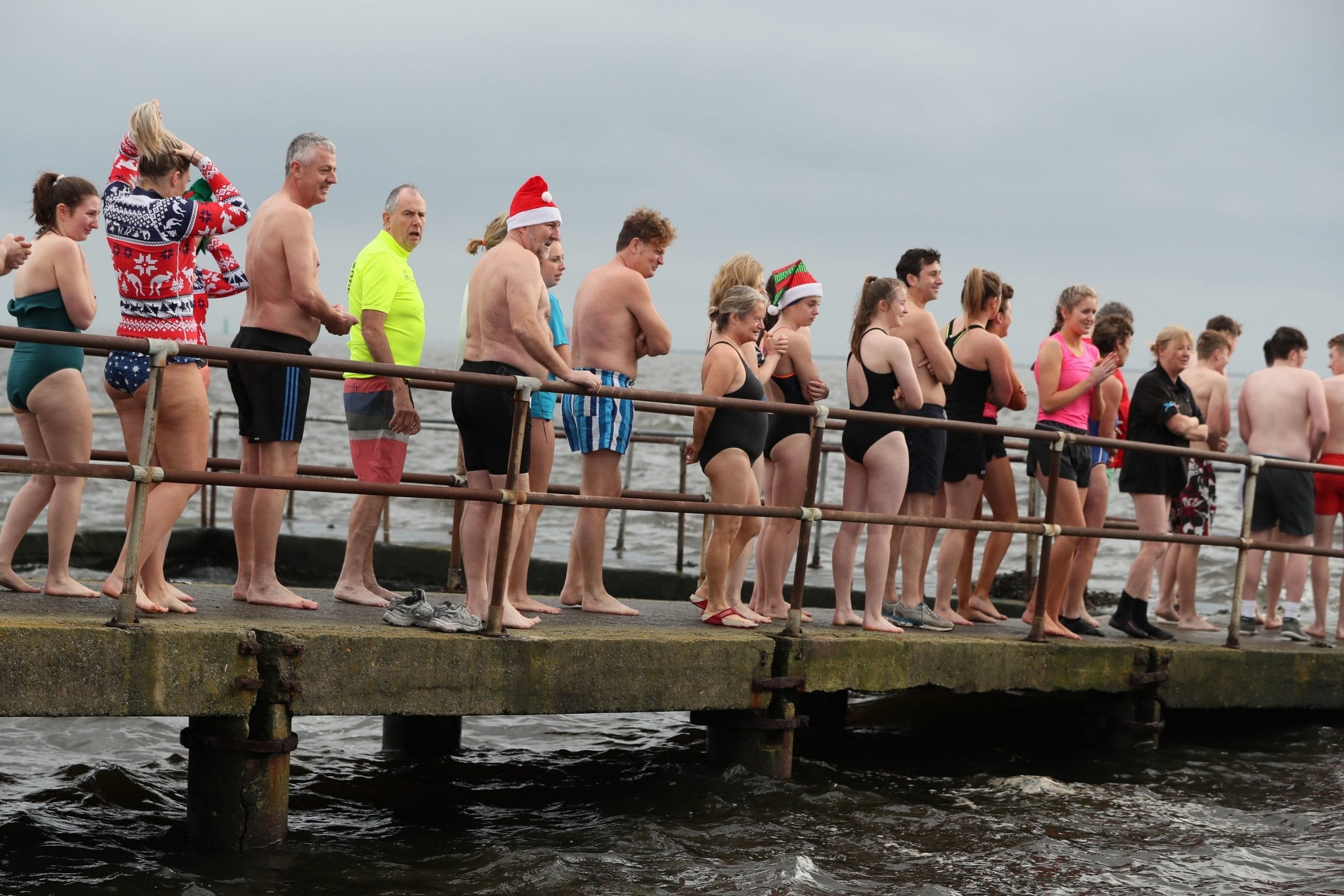 People take part in the Clontarf Yacht &amp; Boat Club annual Christmas swim in aid of the RNLI.