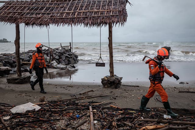 Rescue workers looking for victims yesterday in Carita