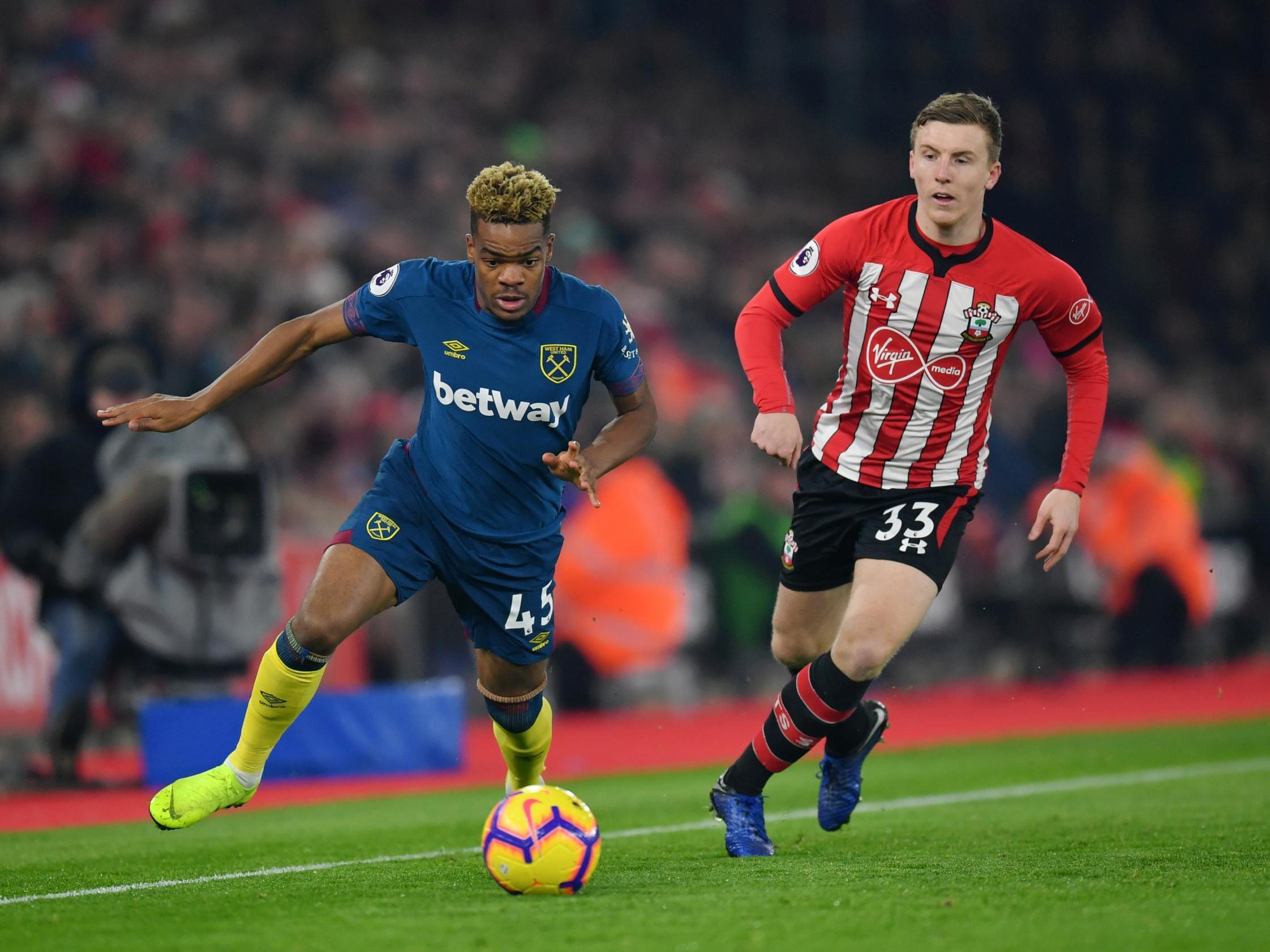 Grady Diangana tries to escape the attention of Matt Targett