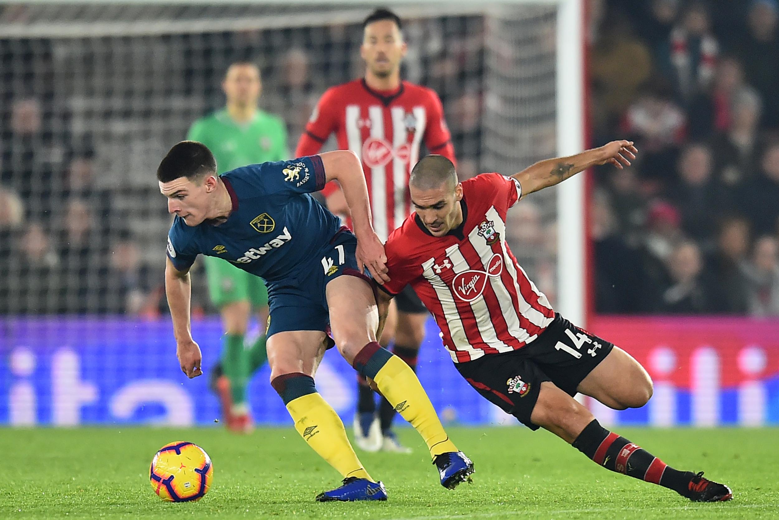 West Ham’s Declan Rice shrugs off Oriol Romeu in midfield