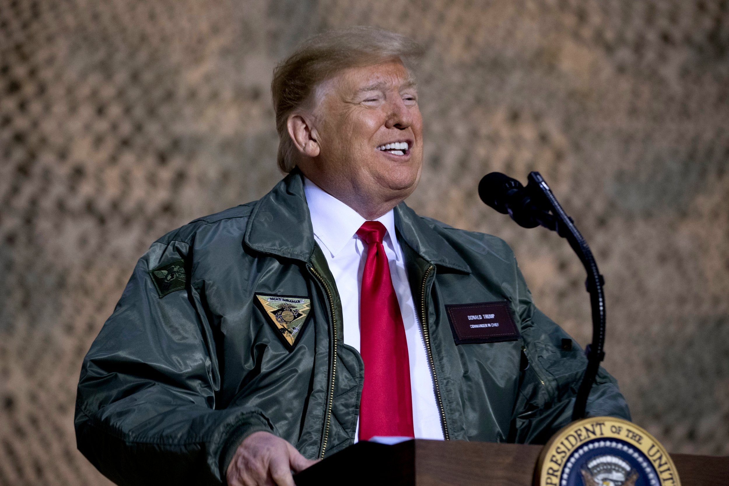 President Donald Trump speaks at a hangar rally at Al Asad Air Base, Iraq on 26 December