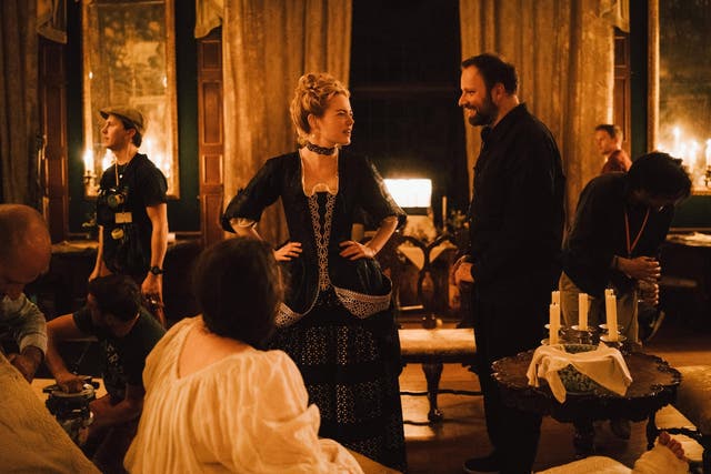 Emma Stone and director Lanthimos on the set of ‘The Favourite’