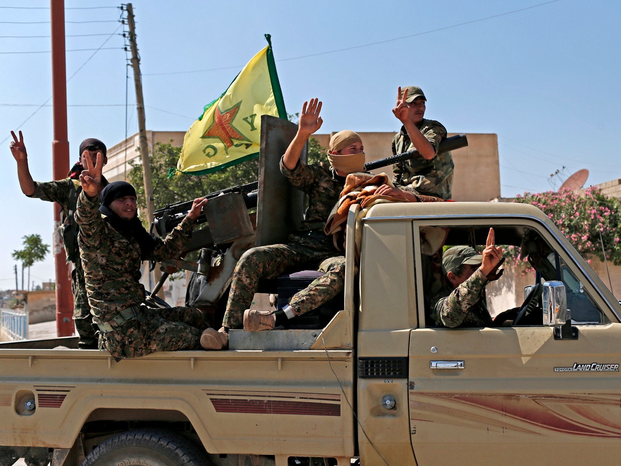Members of the Kurdish People’s Protection Units (YPG) asked the Syrian army to take control of Manbij, according to state television