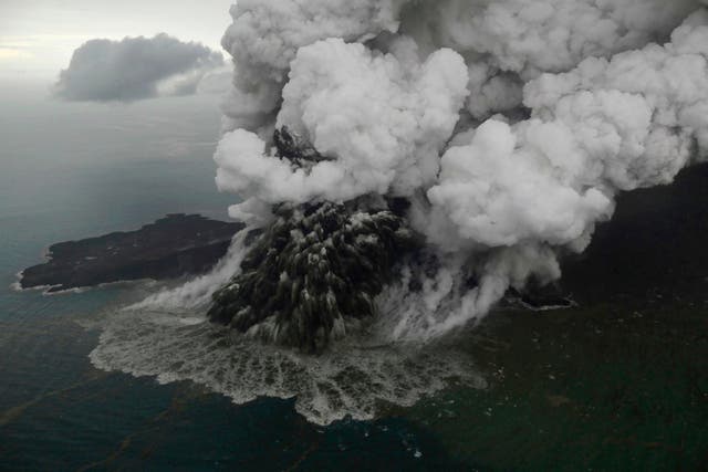 Plumes rise from Anak Krakatau as it erupts in the Java Strait