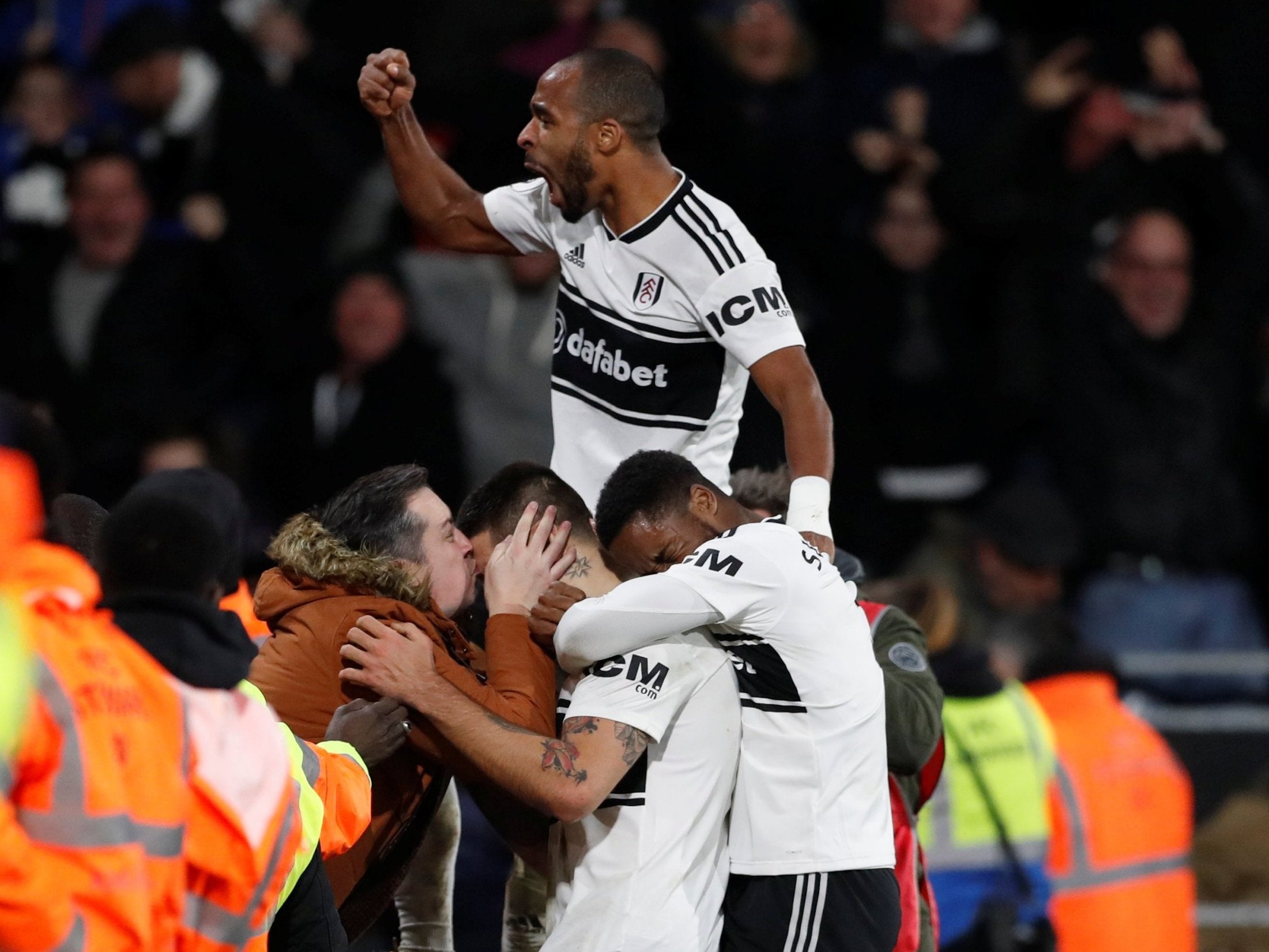 Aleksandar Mitrovic is kissed by an exuberant fan