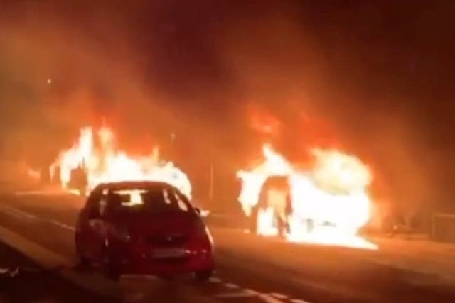 Cars are set on fire during a protest by the 'yellow vests' movement in Paris, France, 29 December